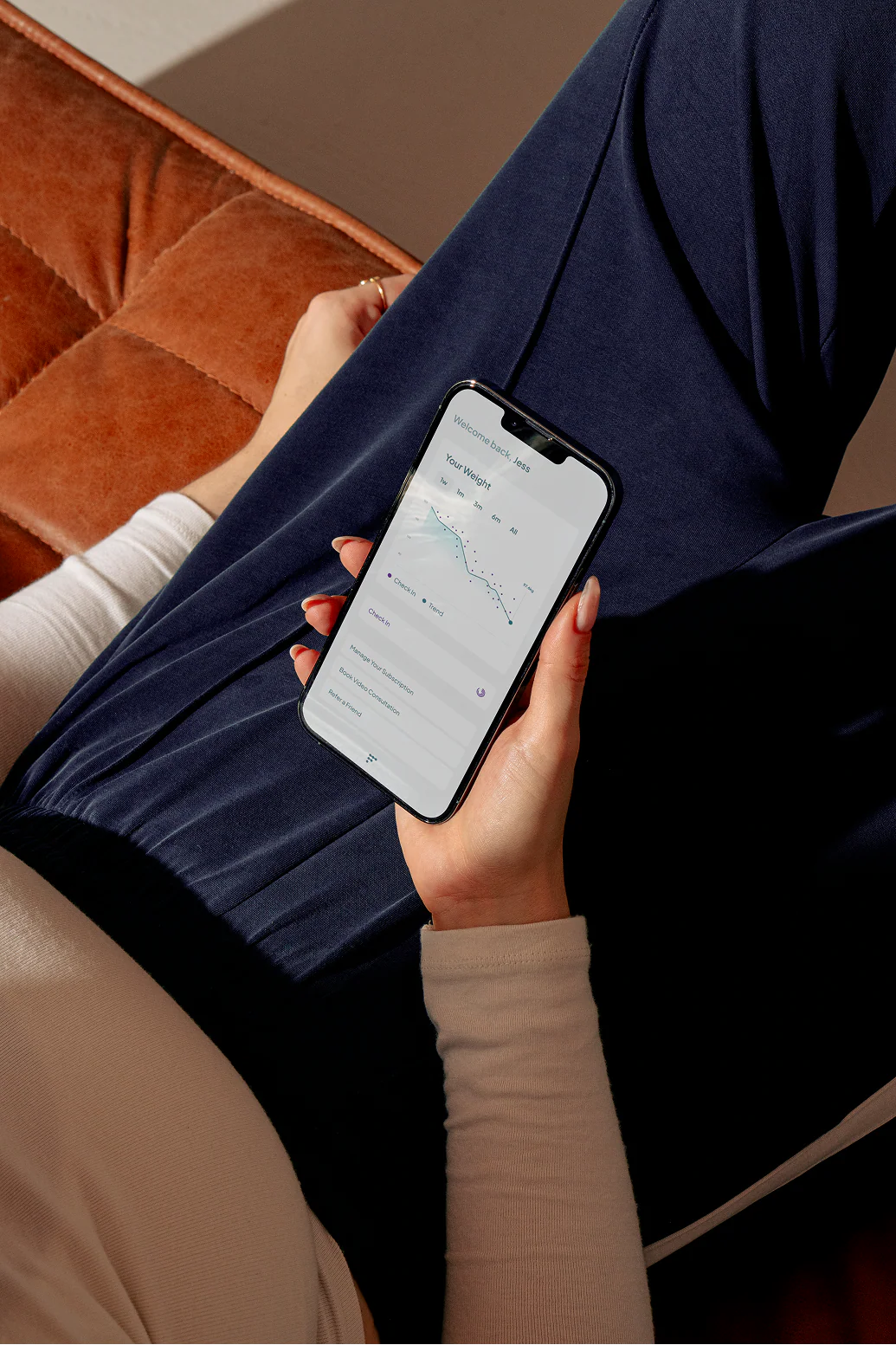 Person using Dr. Frank's app to track weight loss